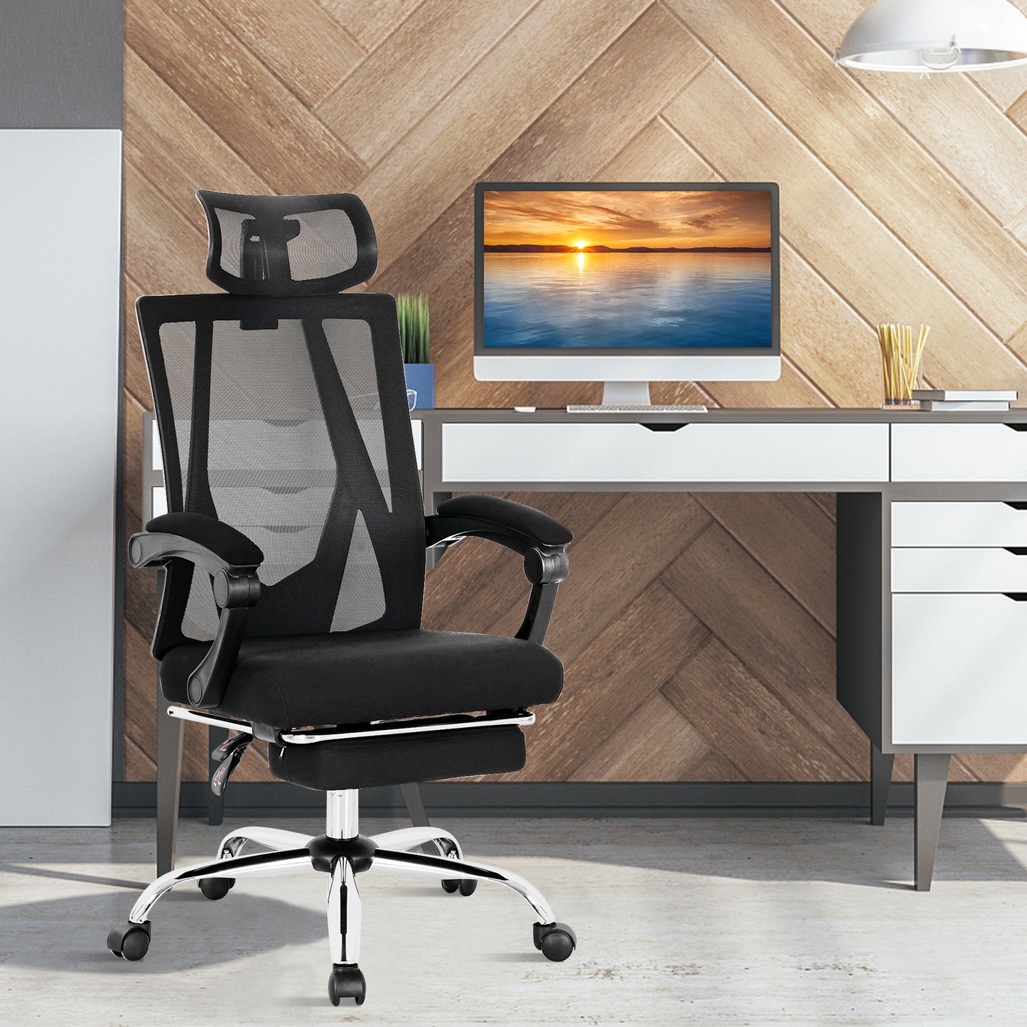 Ergonomic mesh black chair with retractable floor rest at study desk