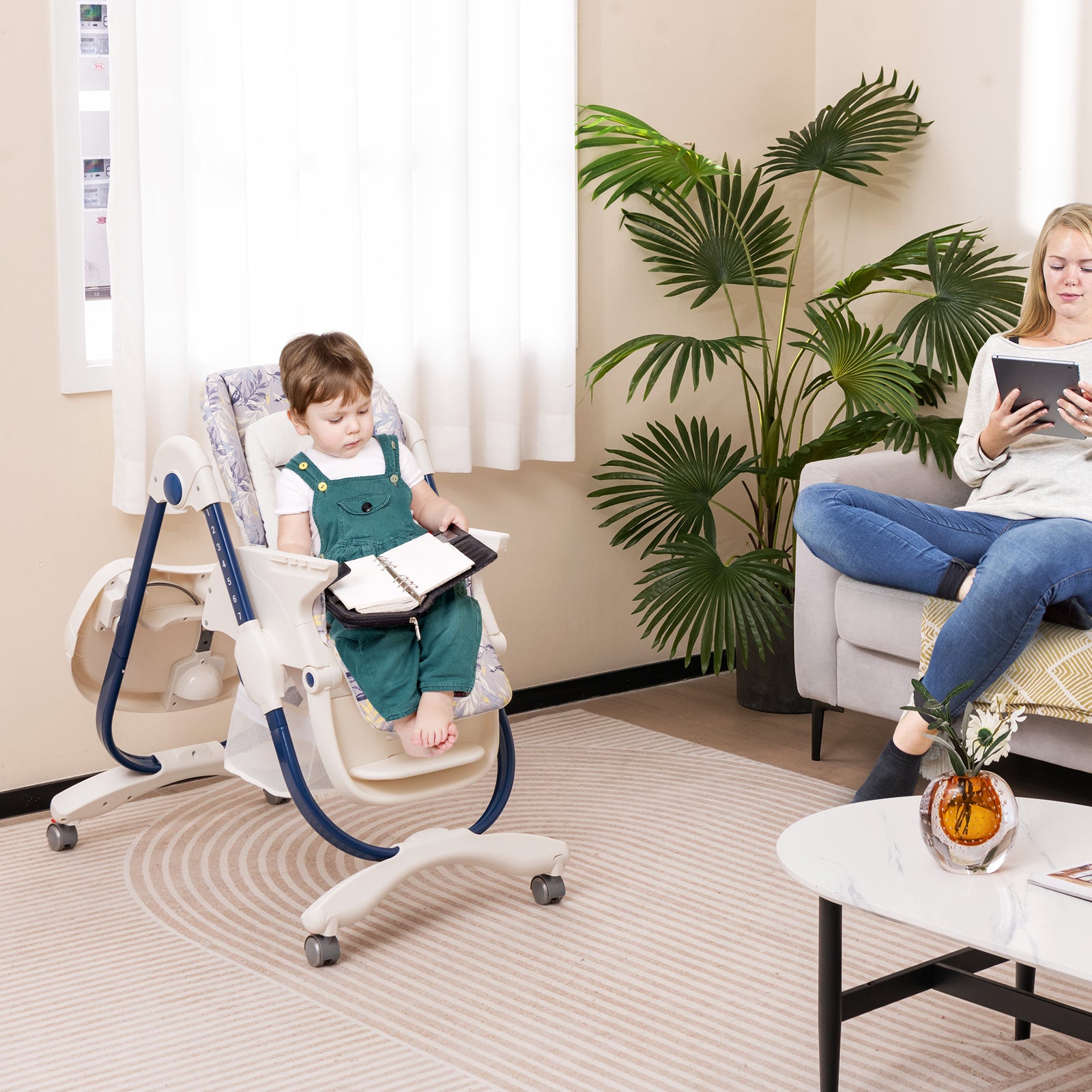 Multifunctional Folding Baby High Chair with Rolling Wheels Black child reading